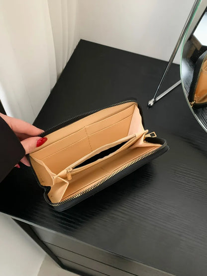 Einfarbige Geldbörse aus PU-Leder.