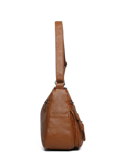 Crossbody-/Umhängetasche mit mehreren Fächern.